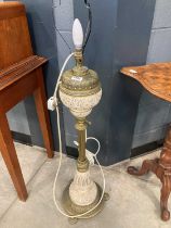 A Victorian brass mounted and earthenware adjustable lamp Damaged to the central resevoir