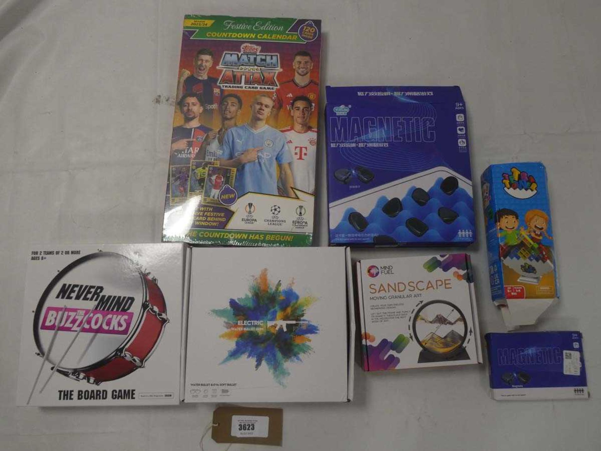 +VAT Selection of toys to include Sandscape, MatchAttax card game, Buzzocks board game, electric