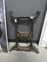 Pair of Singer sewing machine cast iron supports