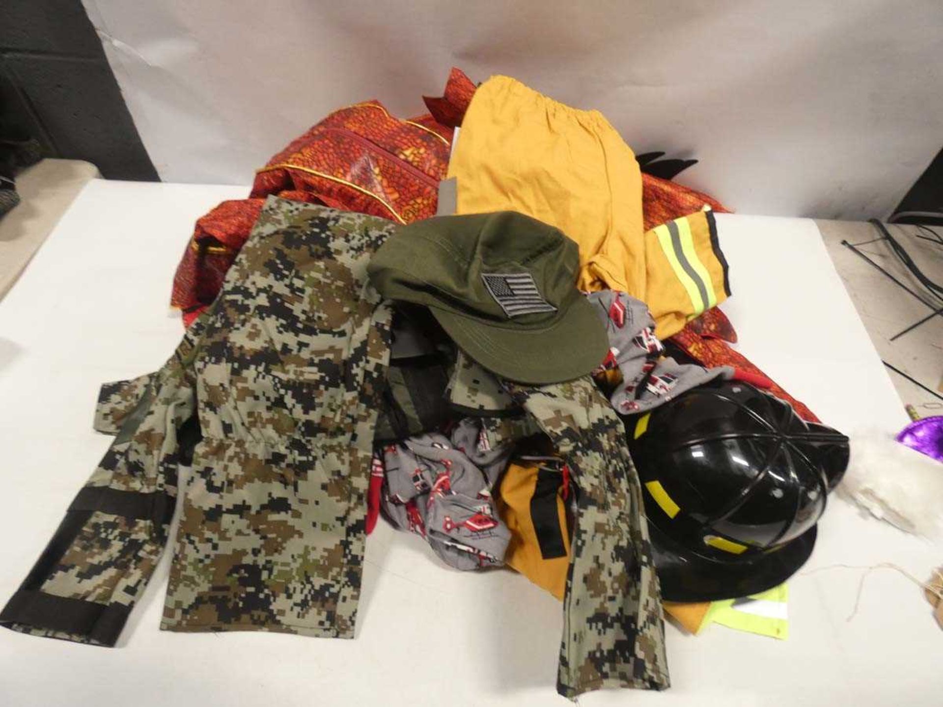 Bag of assorted children's dress-up to include dragons, firemen and military