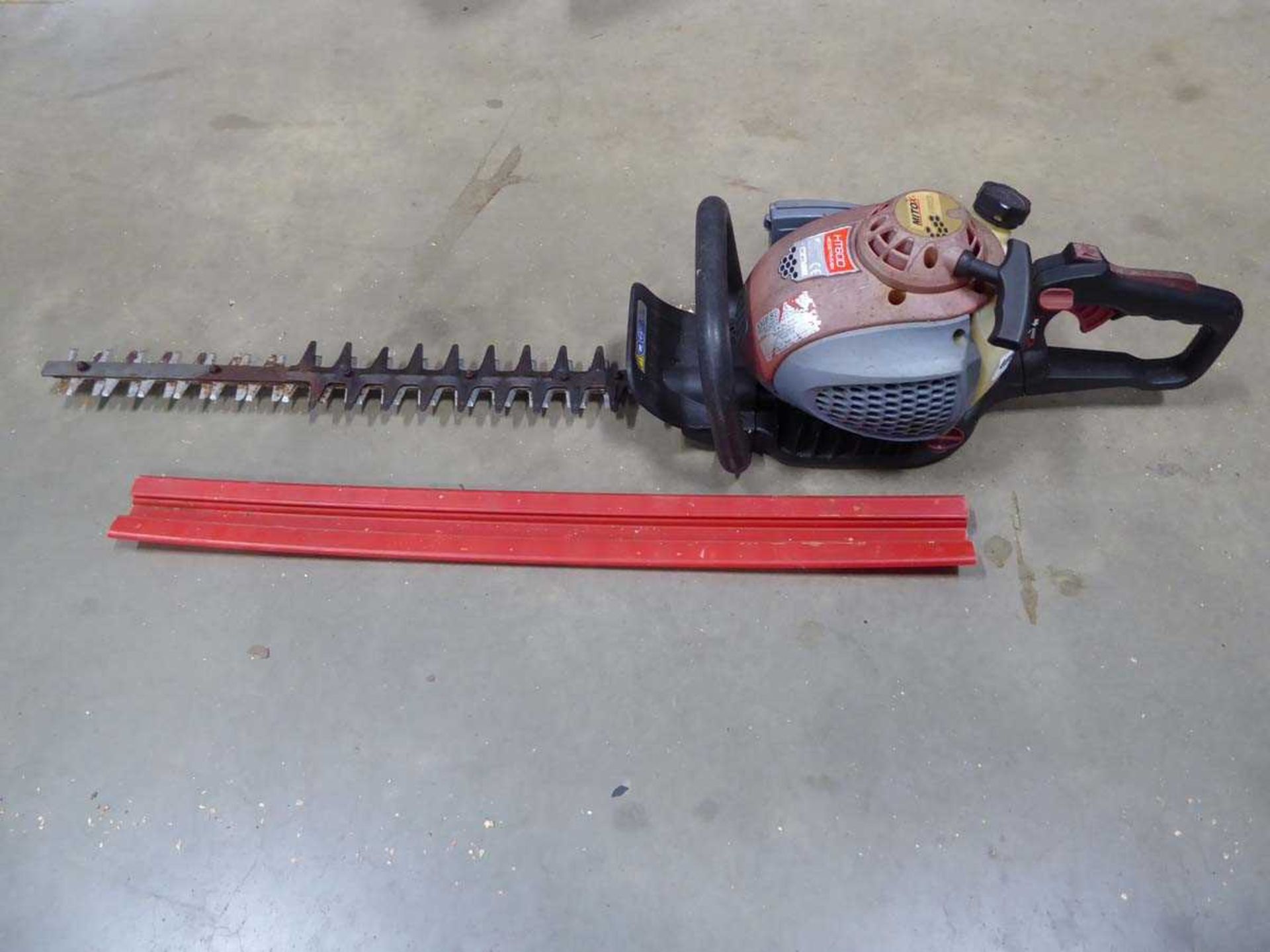 Mitox red petrol powered hedge cutter