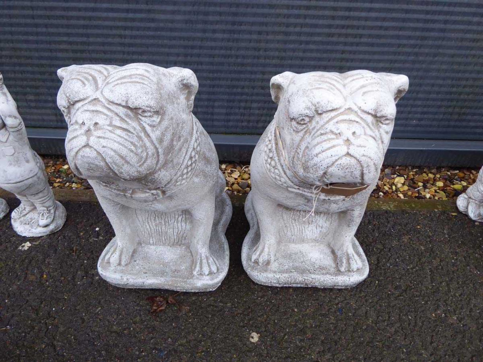 Two concrete bulldogs