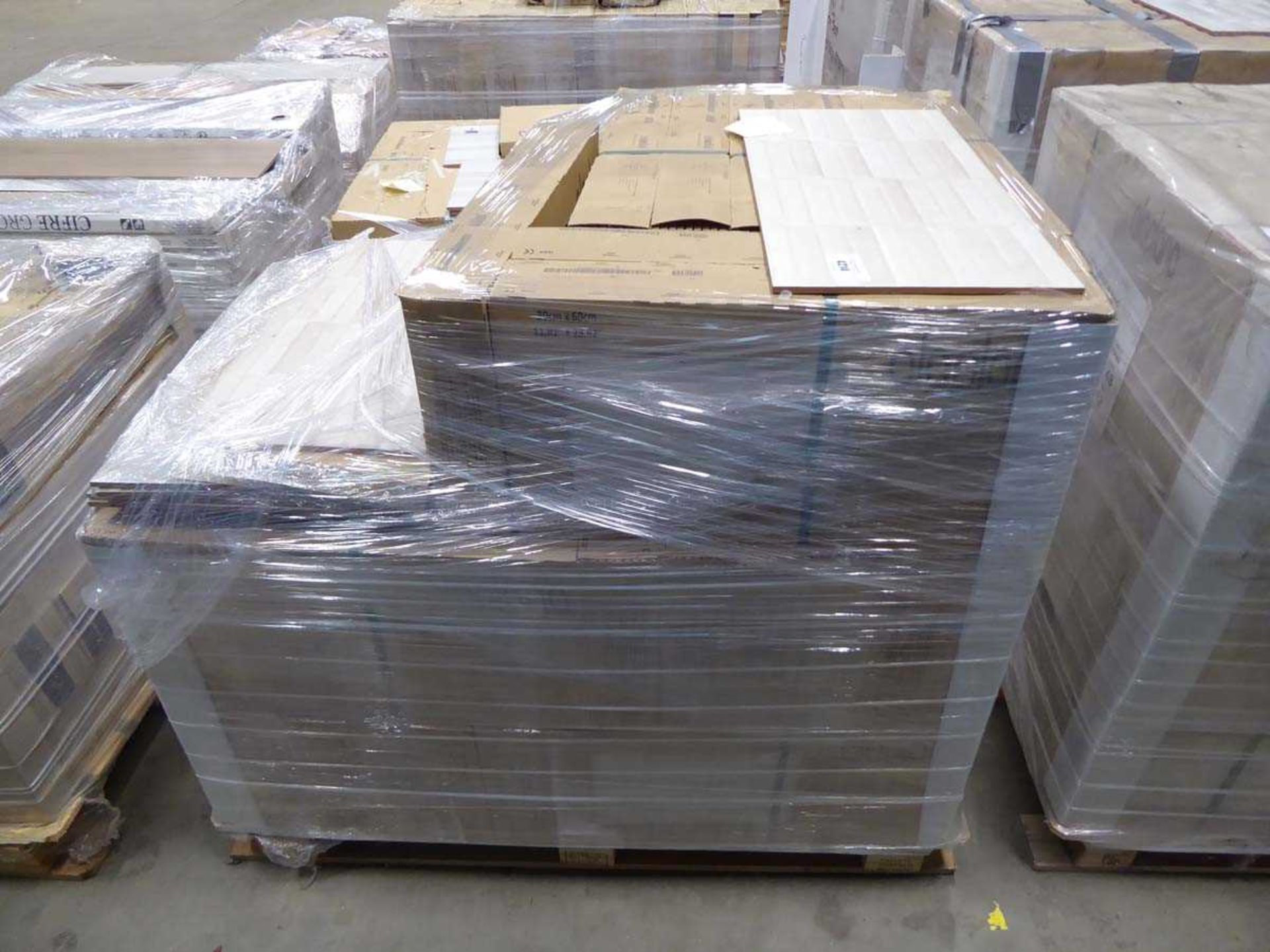 3/4 of a pallet containing 300 x 600 Leeds beige decor tiles