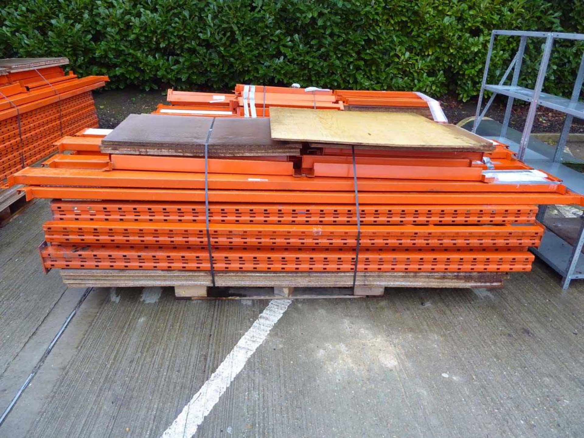 Pallet containing 3 running bays of large orange pallet racking