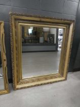 Rectangular mirror in decorative gilt floral frame