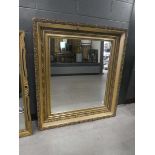 Rectangular mirror in decorative gilt floral frame