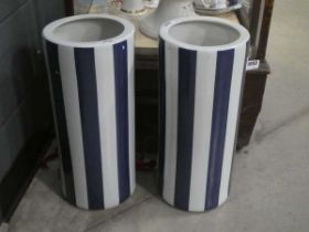 +VAT Pair of blue and white stick stands ( damaged)