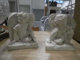 Pair of cherub shaped book ends