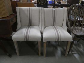 Pair of lime washed and oatmeal fabric upholstered dining chairs