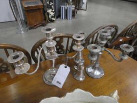 2 silver plated candlesticks and 2 sugar shakers