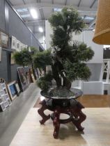 Artificial tree on Chinese stand