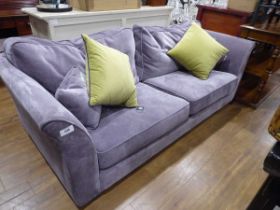 +VAT Large 3 seater sofa in plain mauve material together with 2 small mauve scatter custions and