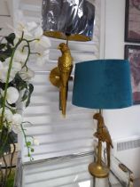 +VAT Gilt ornamental parrot wall lamp with shade together with a similar table lamp