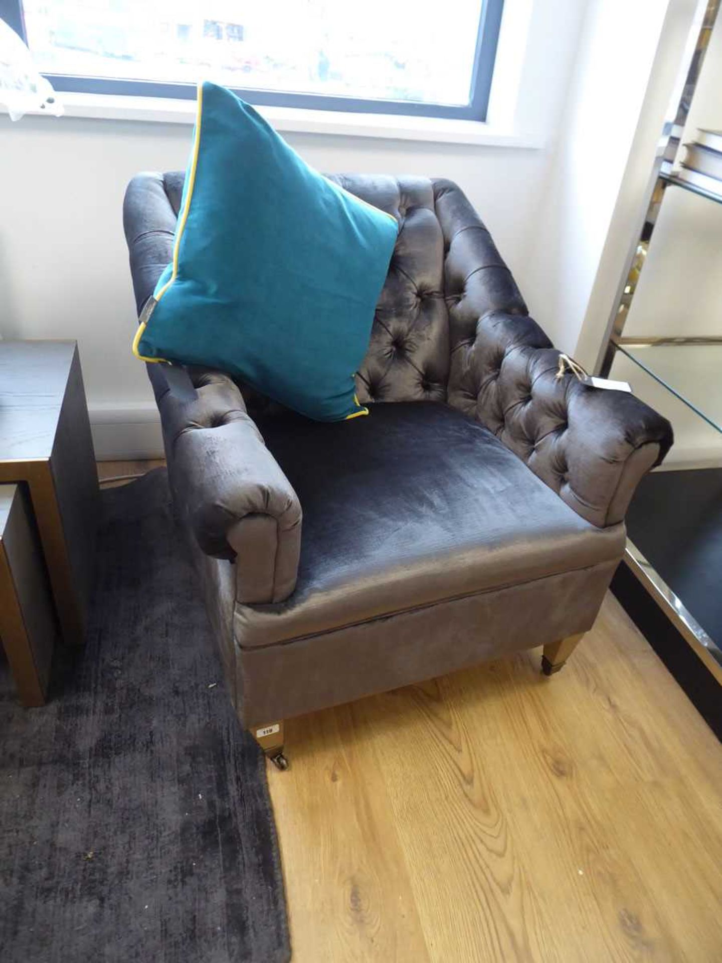 +VAT Chester button back armchair in graphite together with a turquoise loose cushion and a grey