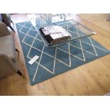 +VAT Turquoise geometric patterned rug, a large Sisal rug and a dark grey rug