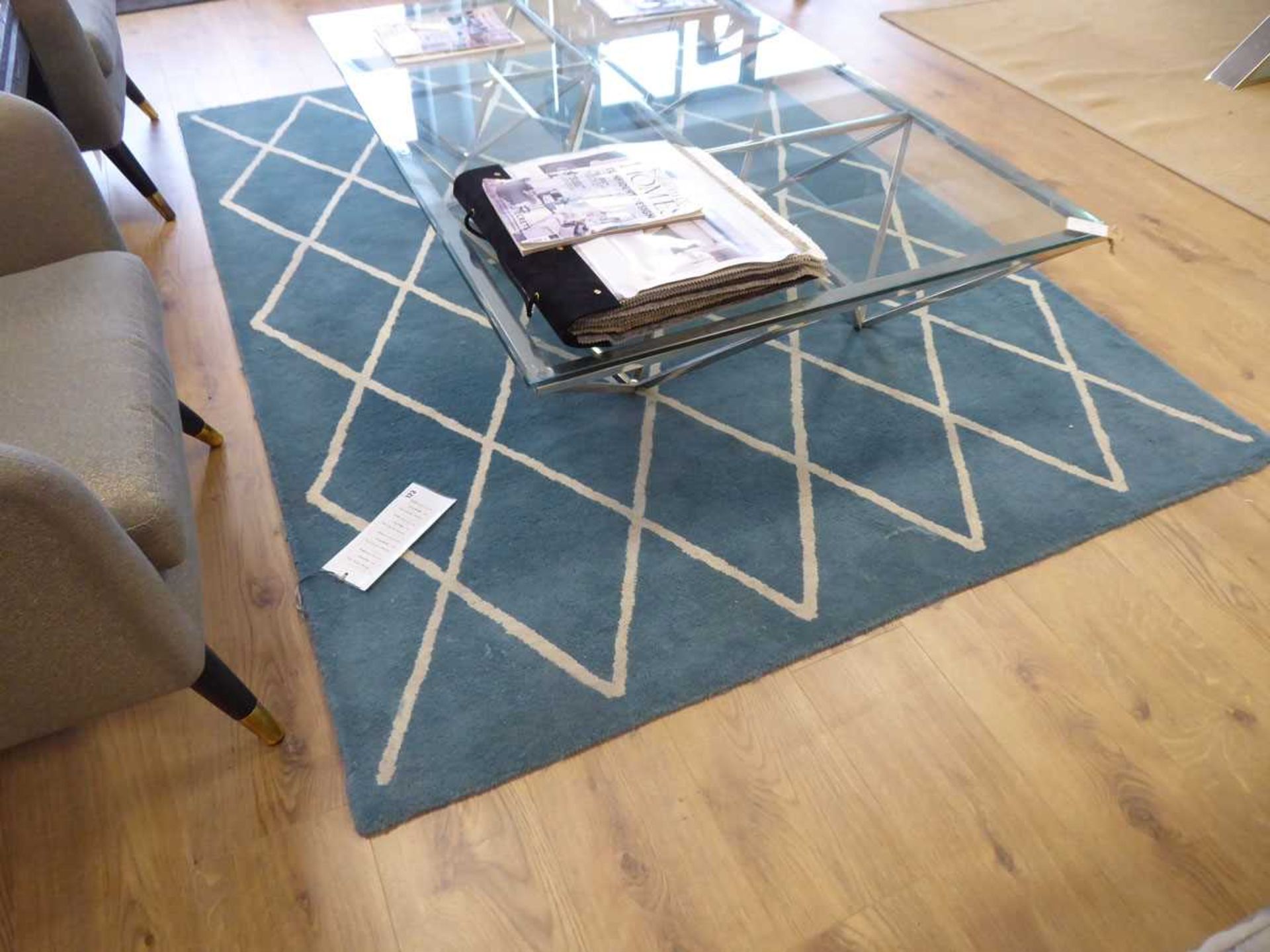 +VAT Turquoise geometric patterned rug, a large Sisal rug and a dark grey rug