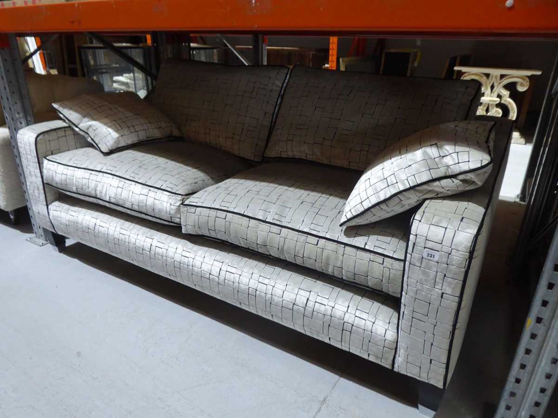 +VAT Large 2 seater sofa in black and silvered patttern material with 2 scatter cushions