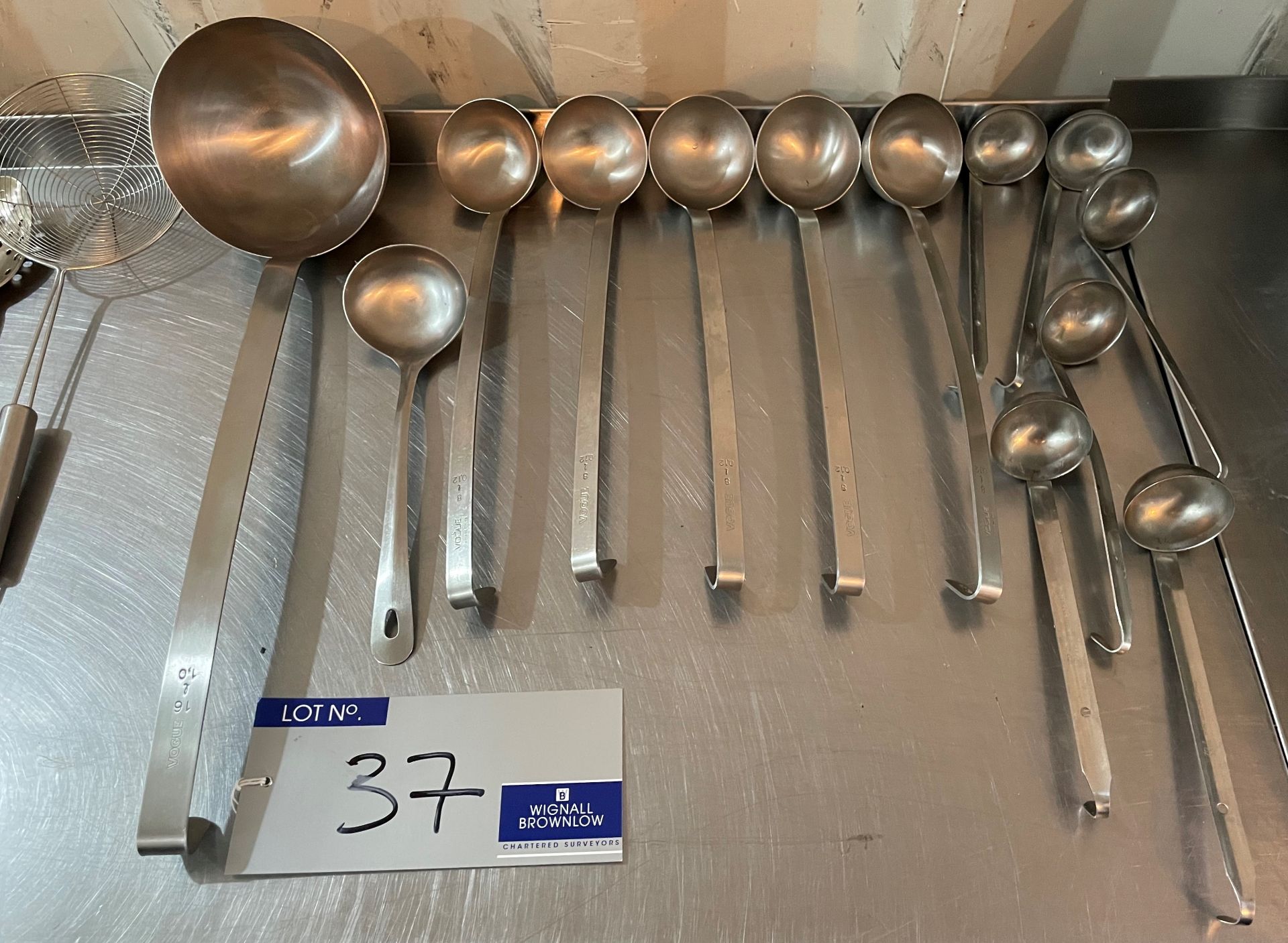 A Quantity of Assorted Kitchen Utensils including ladles, spoons, slices and tongs (located at EMS