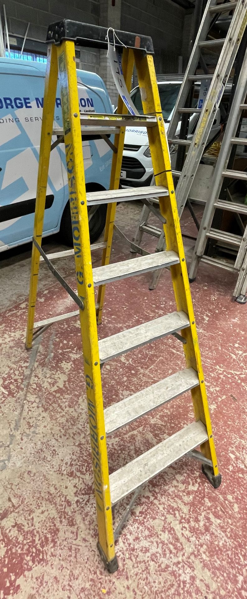 A Fibre Glass 7 rise Electricians Stepladder, 150kg cap, 6ft h (located at George Morrison ELP,