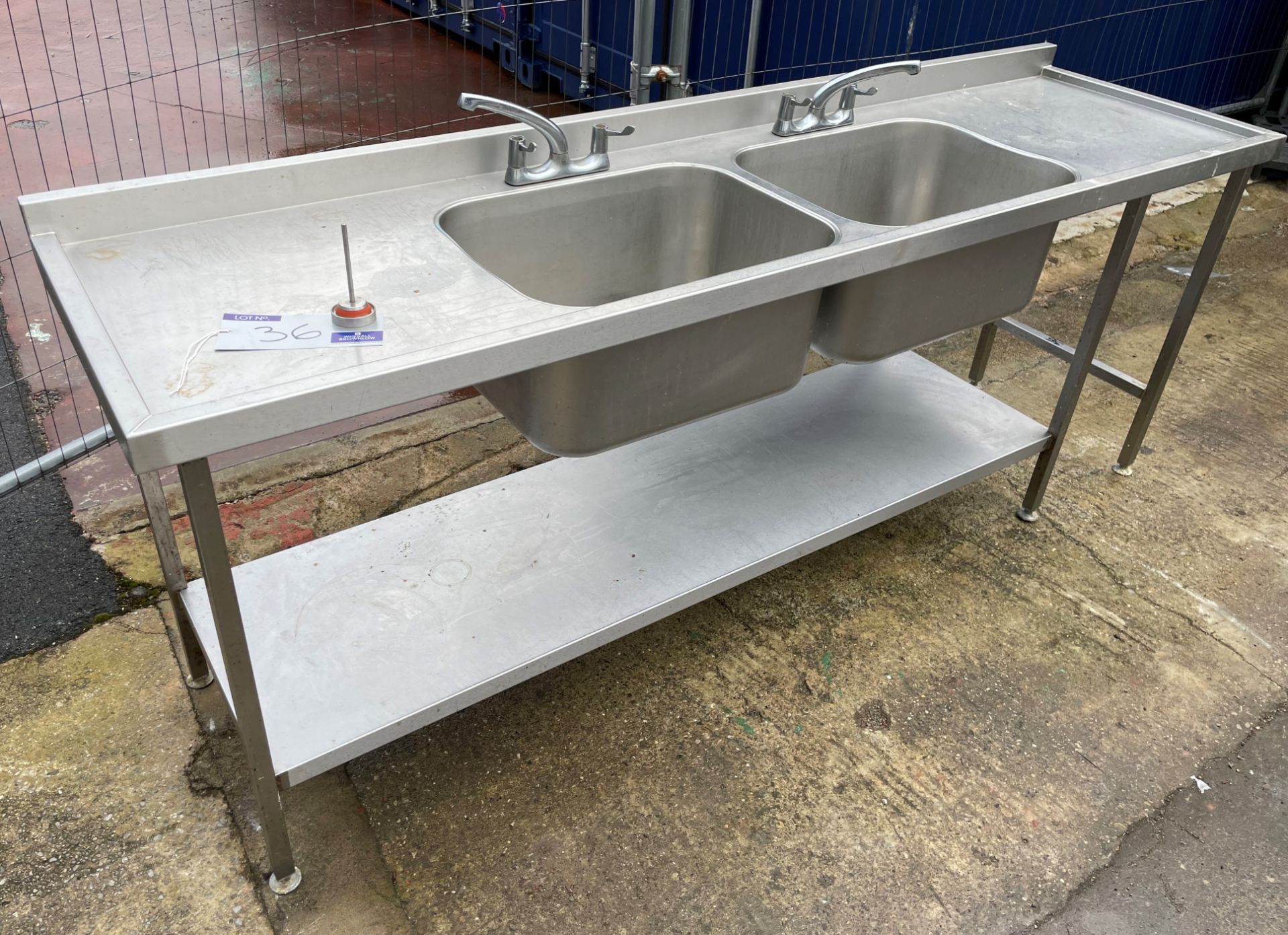 A Stainless Steel Double Bowl Double Drainer Sink Unit, 240cm x 65cm x 90cm with undershelf (located