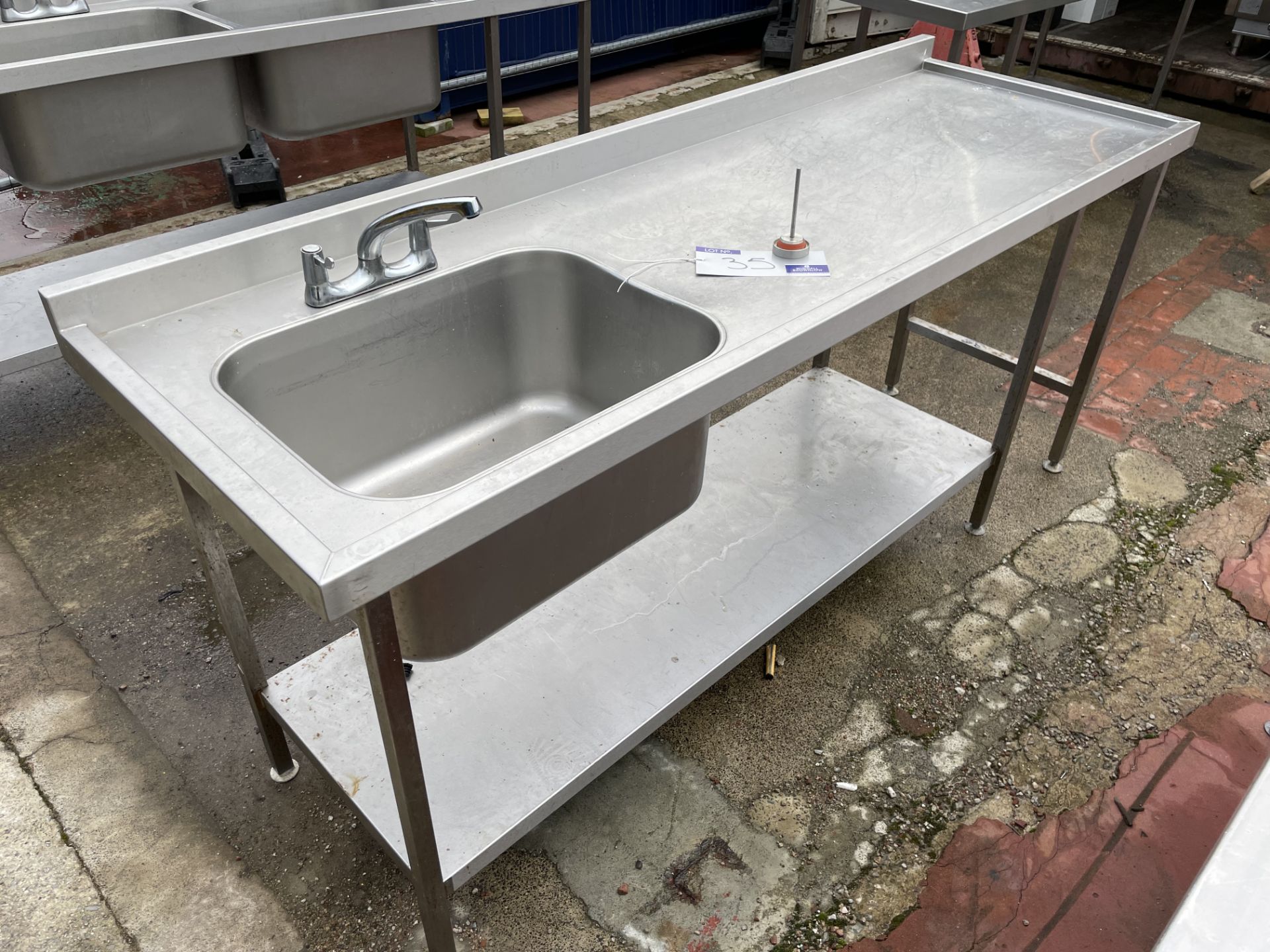 A Stainless Steel Single Bowl Single Drainer Sink Unit, 210cm x 70cm x 90cm with undershelf (located