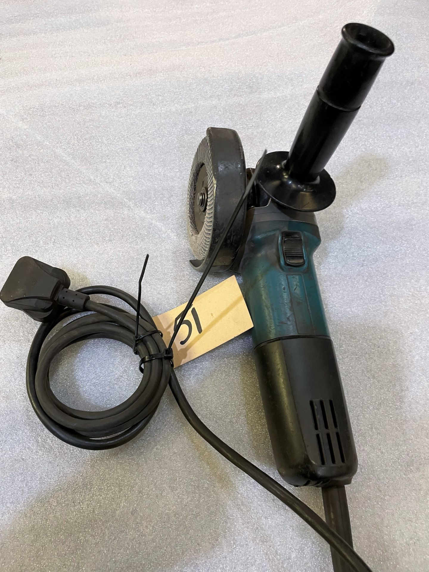 A Makita 9557NB 115mm Angle Grinder, 240v.