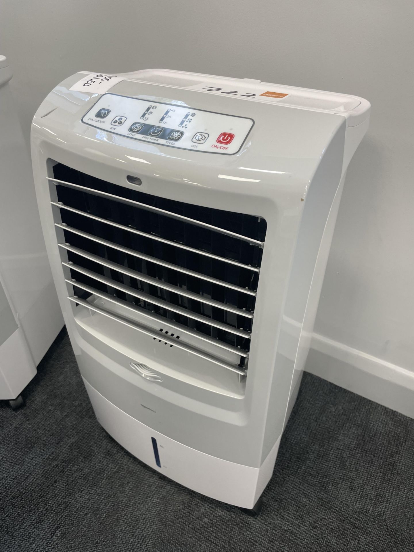 An Amazon Basics AC120-15F mobile osculating 3 in 1 air cooler.