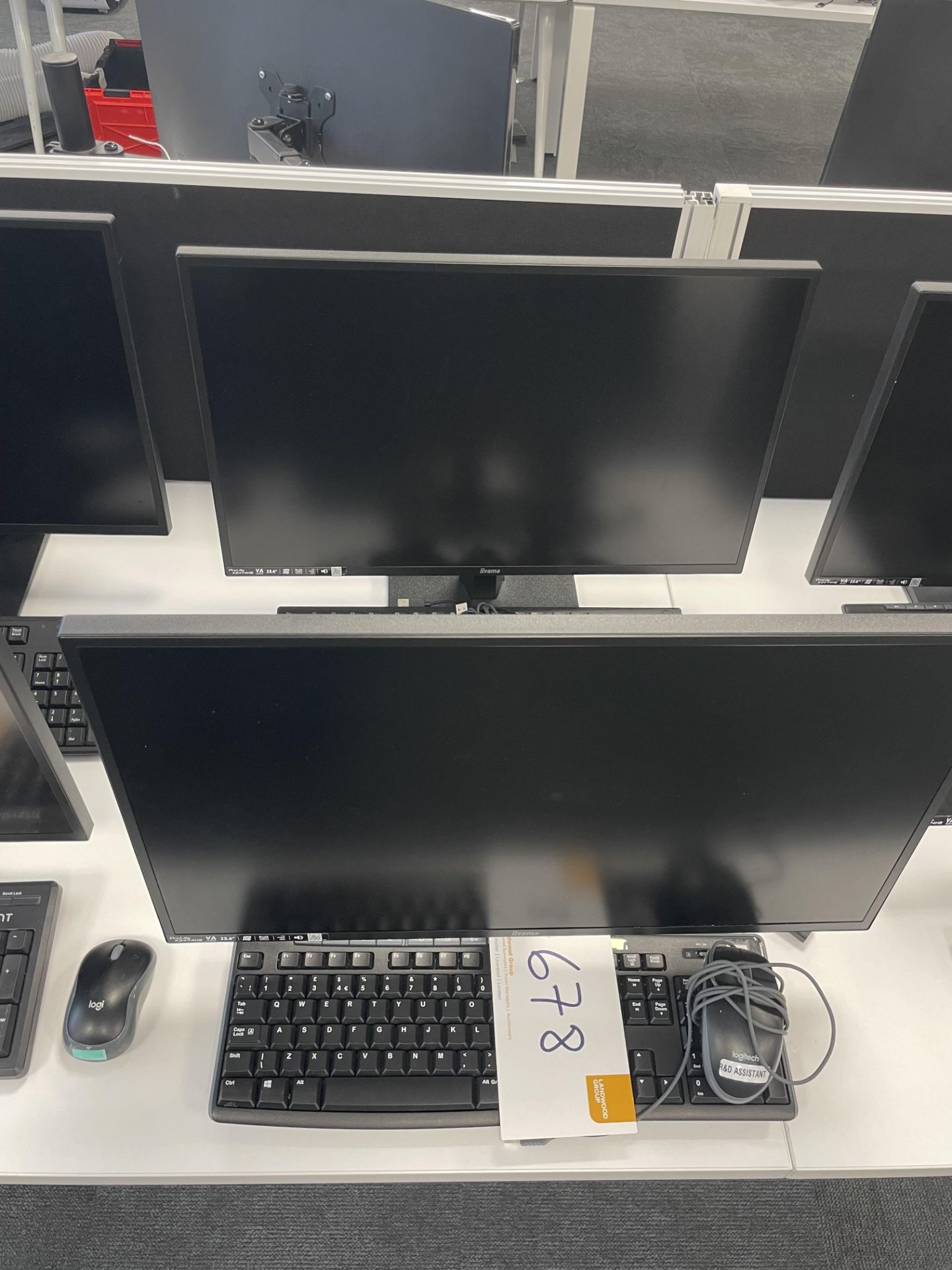 2 iiyama ProLite X2474HS monitors each with keyboard and mouse.