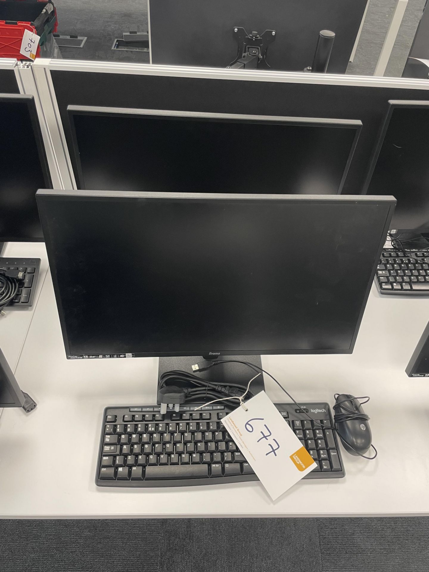 2 iiyama ProLite X2474HS monitors each with keyboard and mouse.
