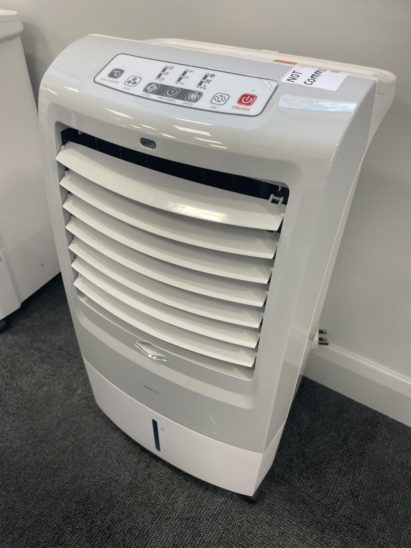 An Amazon Basics AC120-15F mobile osculating 3 in 1 air cooler.
