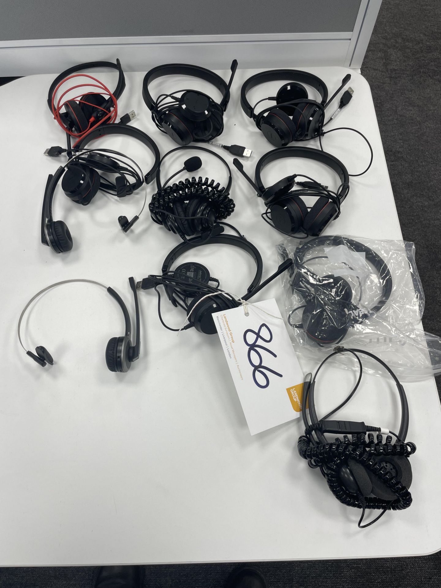 11 assorted USB headsets.