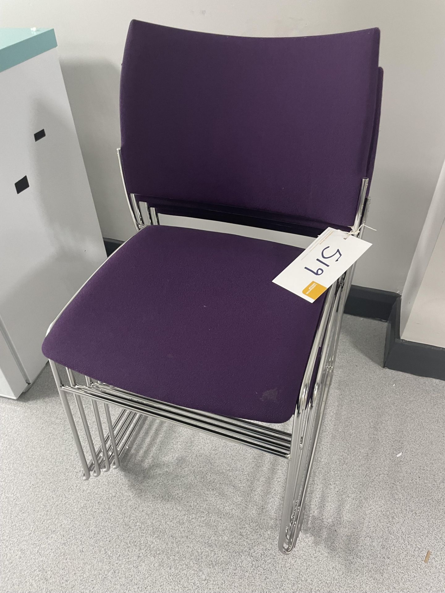 4 purple fabric upholstered chrome steel framed office chairs.