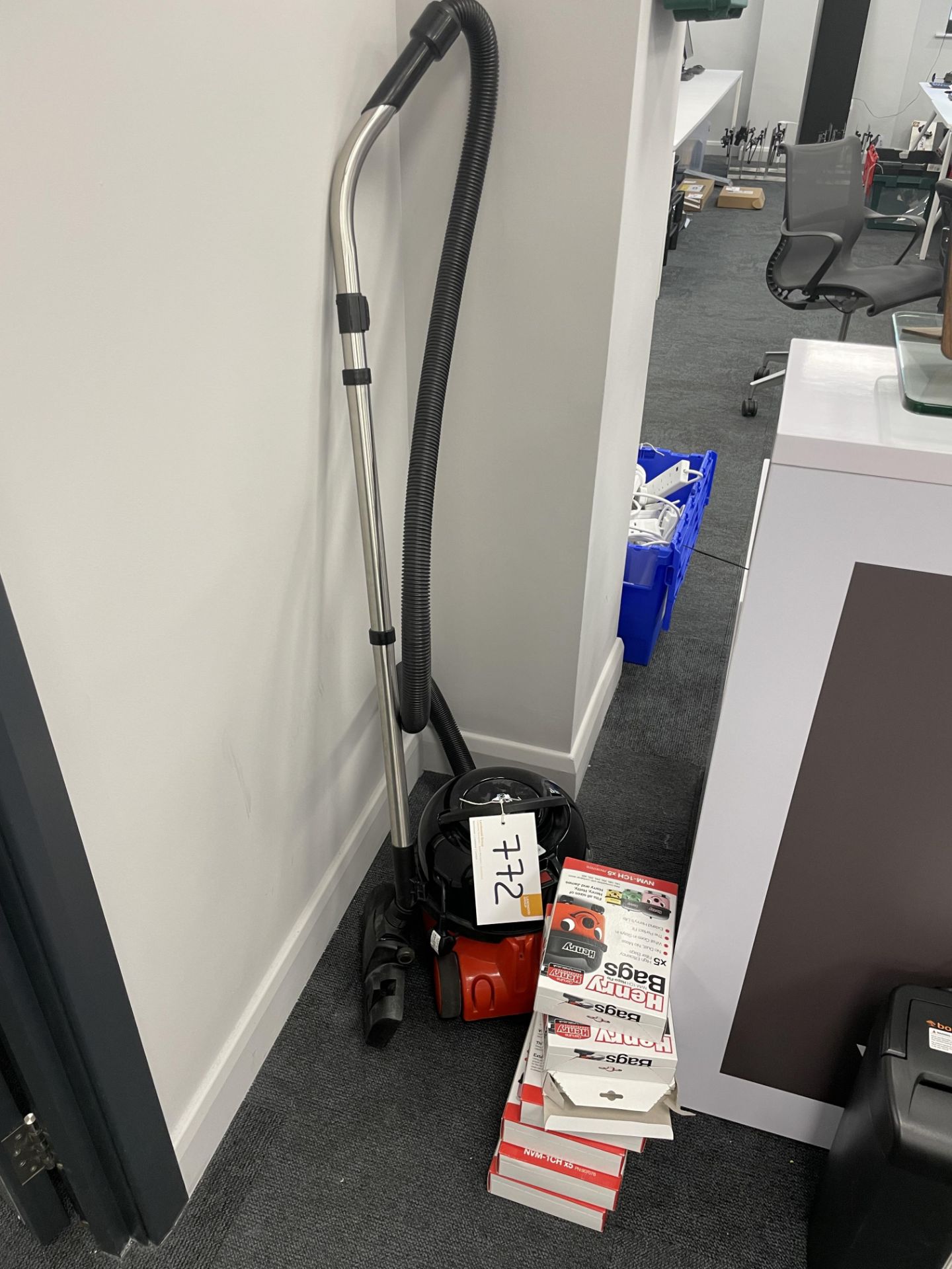 A Numatics HVR160-11 Henry type vacuum cleaner with a quantity of filter bags.