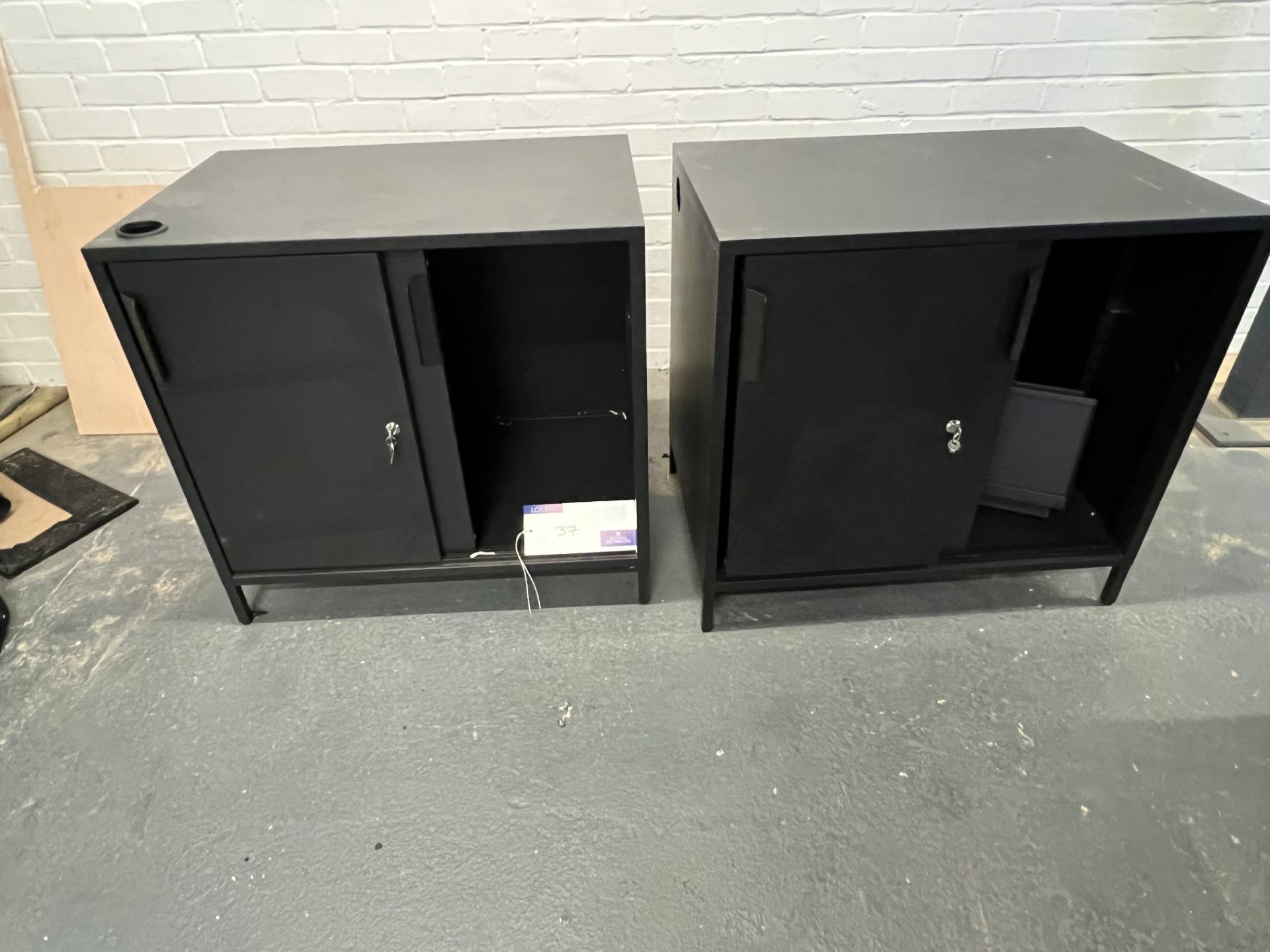2 Black Cabinets (located at Visions, Unit 14, Suttons Business Park, Reading, Berkshire, RG6 1AZ).