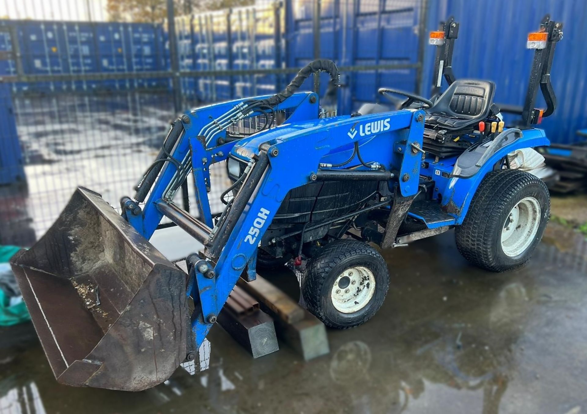 A New Holland TC24D Compact Utility Tractor, Reg. No.RX10GMU, with Lewis 25QH Loader, 48in bucket,