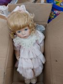 Vintage China doll in pink dress