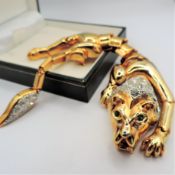 Circa 1980's Gold Plated Crystal Lion Articulated Shoulder Brooch 7 inches Long