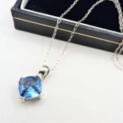 Sterling Silver Blue Topaz Pendant Necklace.