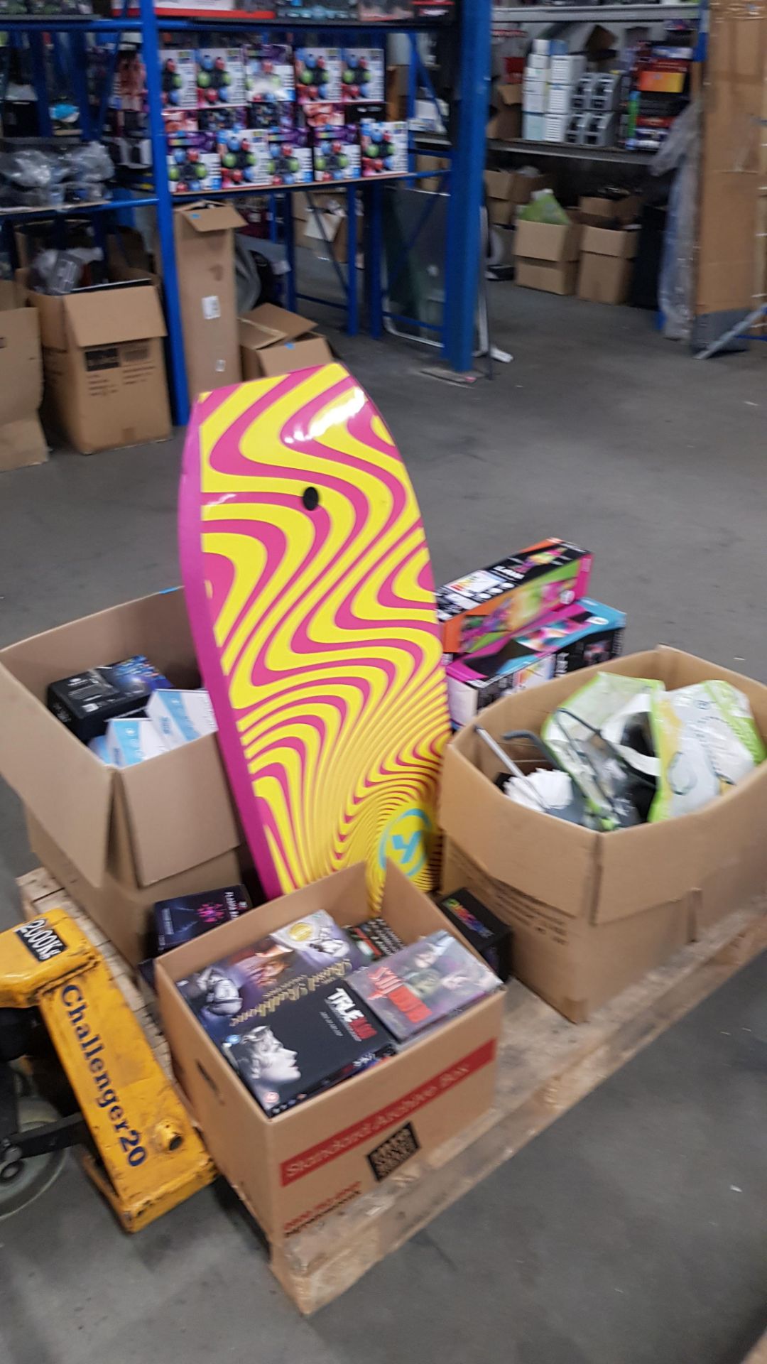(Lot 352/P) Contents Of Pallet. Mixed Lot To Include Boogie Board, Lava Lamps. Box Of DVDs. Well Be