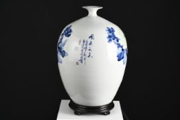 Porcelain Blue and White Floral Vase with wooden base