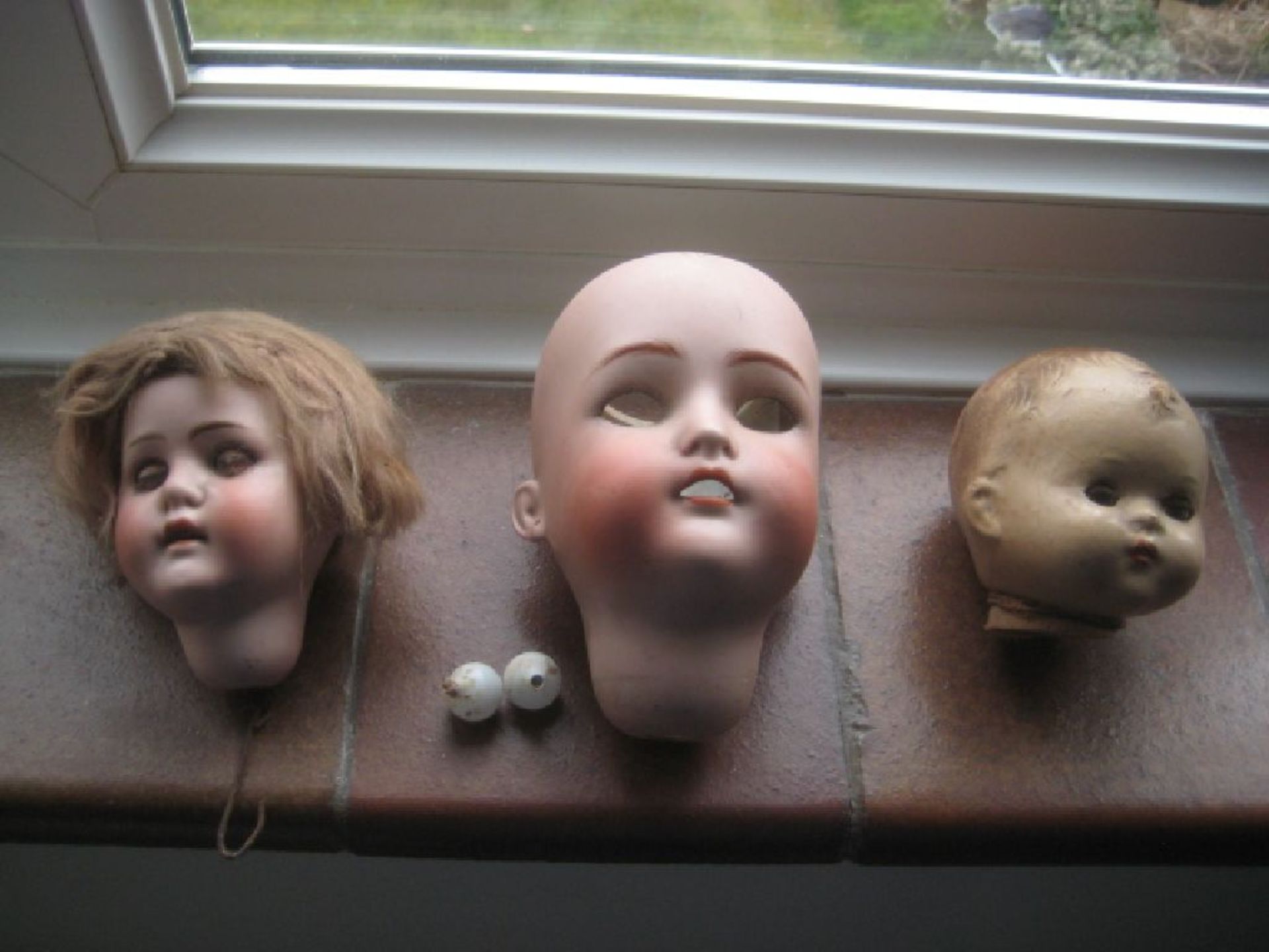 Three Vintage Dolls Heads