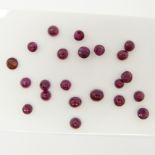 Parcel of 22 Loose Cabochon Rubies and A Round-cut Garnet. 3.29 Carats Total