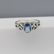 Silver Ring Set With An Oval Light Blue Cubic Zirconia and Celtic Patterned Shoulders