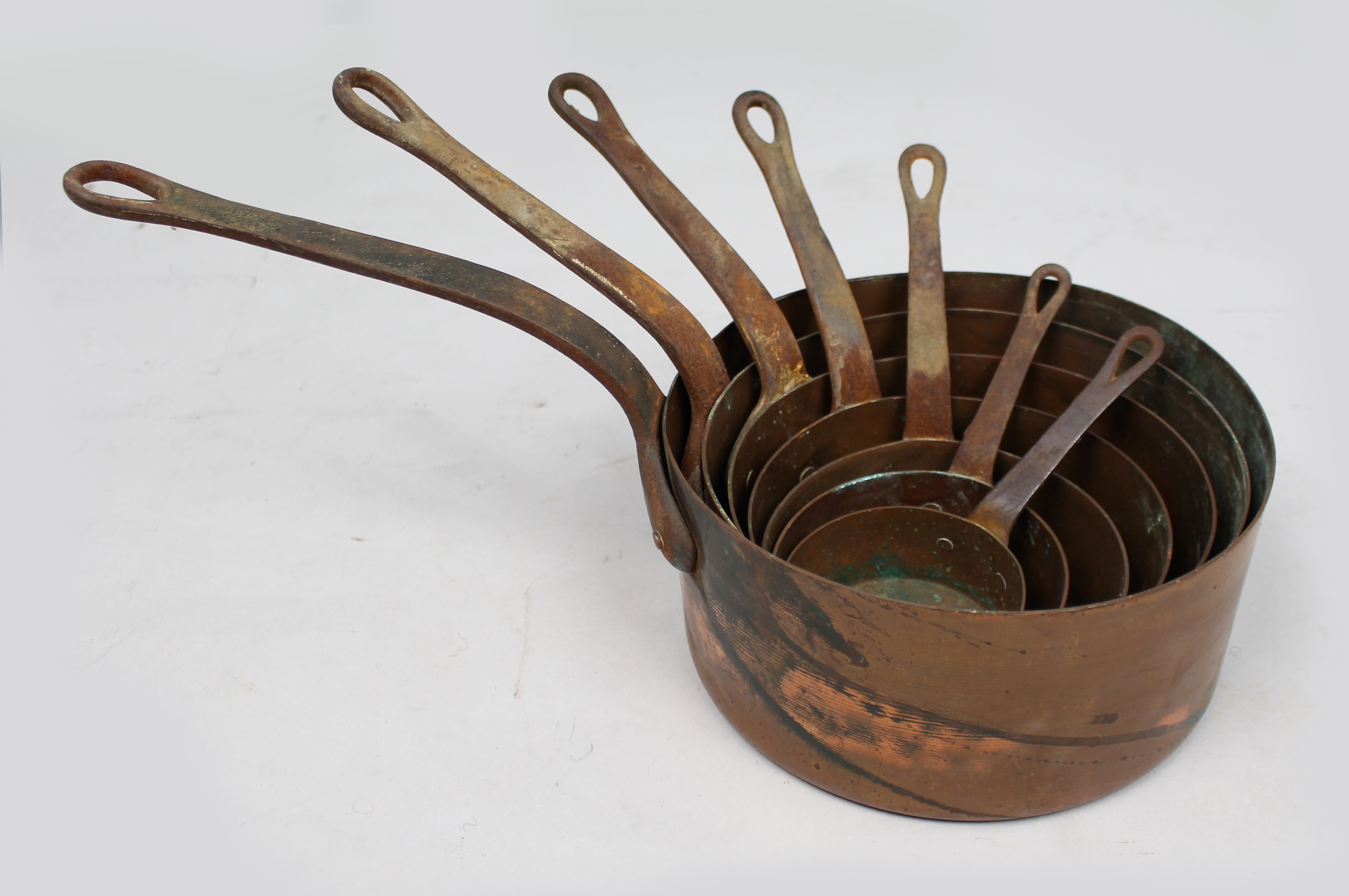 Set of 7 Graduated Copper Saucepans