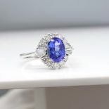 Stylish 1.37 Carat Tanzanite and 0.57 Carat Diamond Cluster Ring In 18ct White Gold