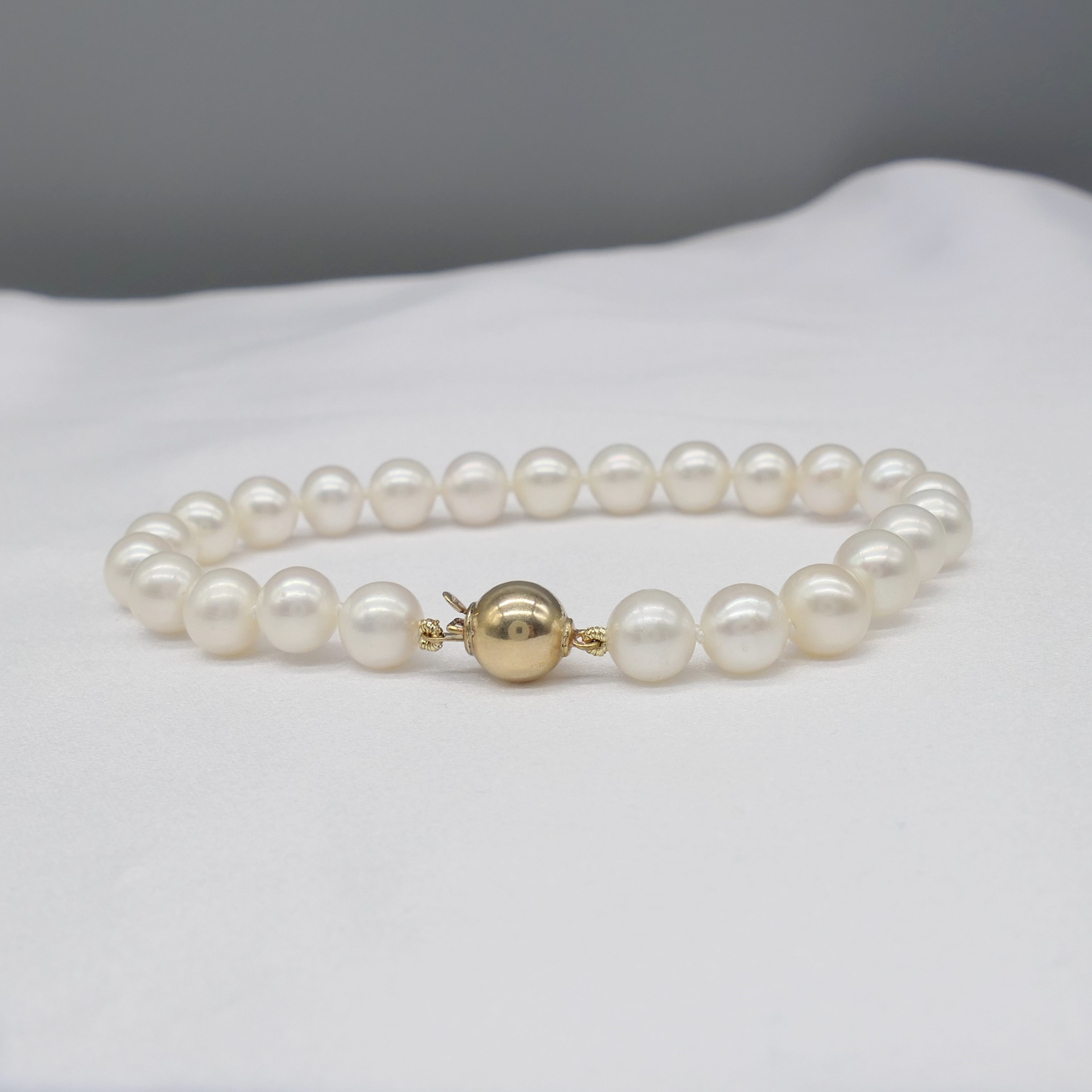 White Cultured Pearl Strung Bracelet With Yellow Gold Ball Clasp