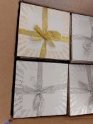 Box of 96 white coasters with gold and silver patterns
