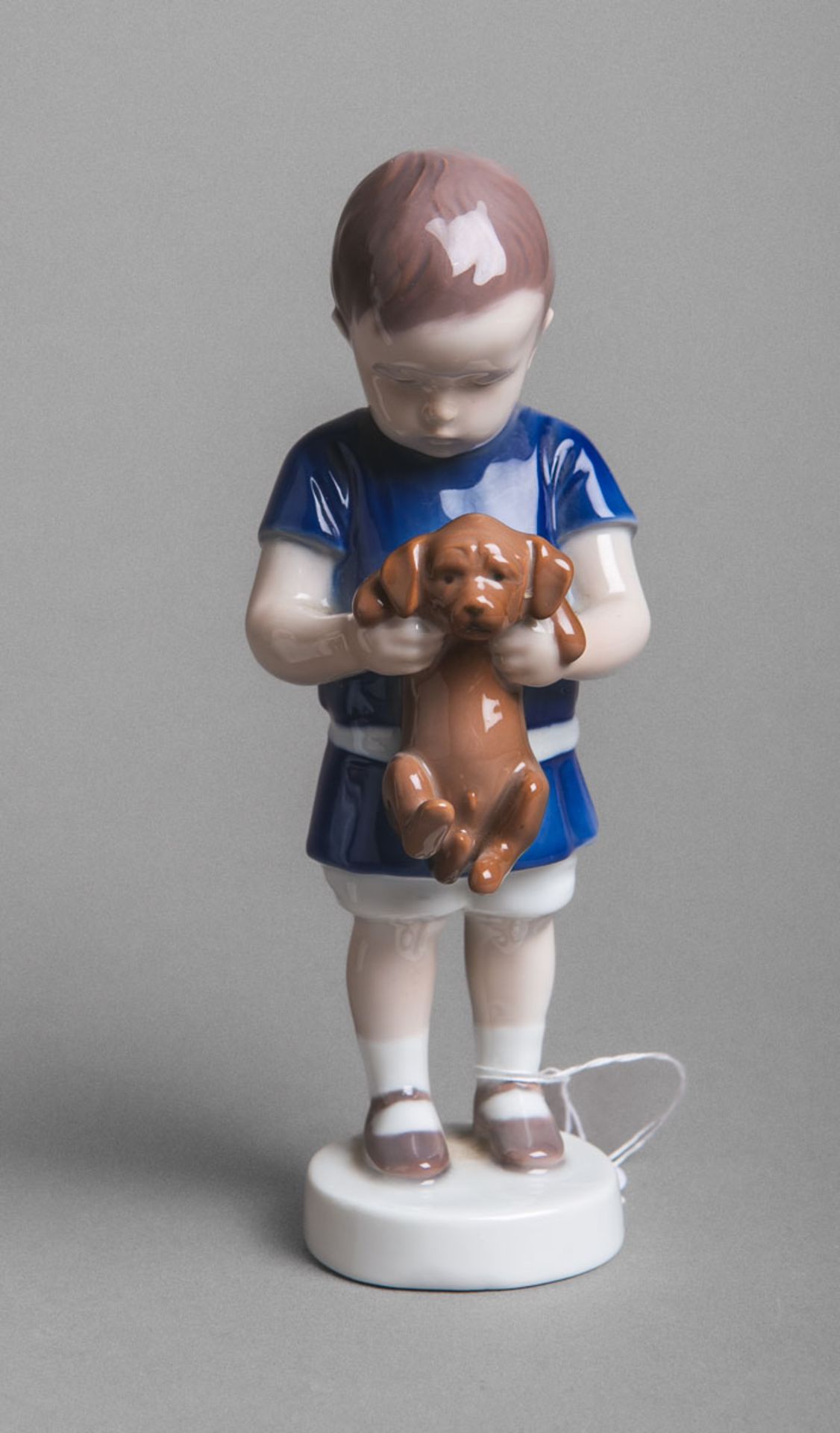 Porzellanfigur "Junge mit Hund" (B u. G, Copenhagen)