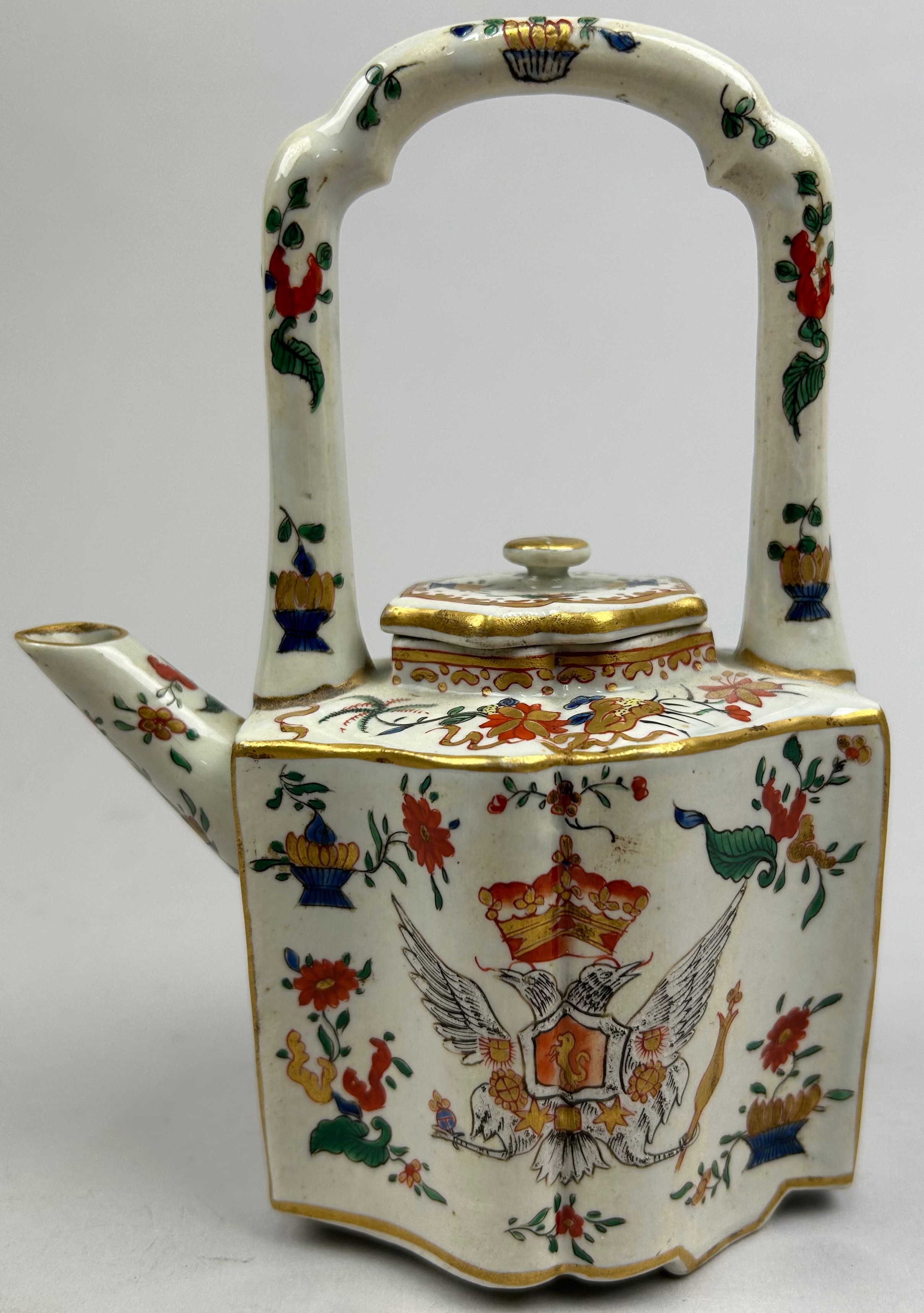 A CONTINENTAL PORCELAIN TEA POT, depicting a royal coat of arms