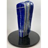 A LARGE FREEFORM LAPIS LAZULI SPECIMEN FROM AFGHANISTAN, polished with granite base Weight 11 kg